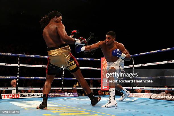 Anthony Joshua of England lands a punch on Charles Martin of the United States during the IBF World Heavyweight title fight at The O2 Arena on April...