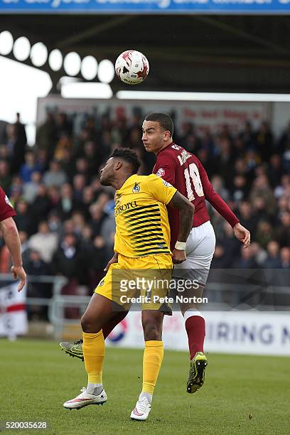 Rod McDonald of Northampton Town contests the ball with Ellis Harrison of Bristol Rovers during the Sky Bet League Two match between Northampton Town...