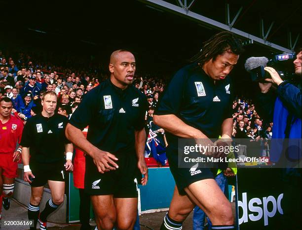 October 1999 - Rugby World Cup - New Zealand v Tonga - Lomu and Umaga of the All Blacks lead the team out for the match.