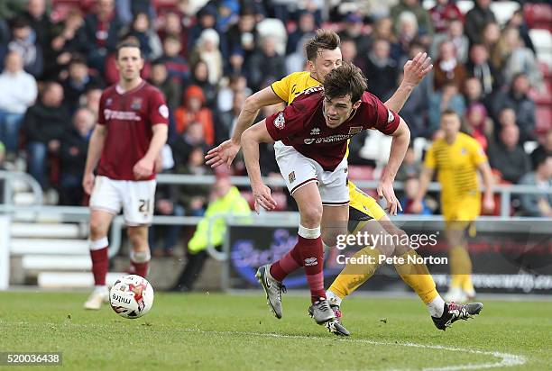 John Marquis of Northampton Town attempts to move away with the ball under pressure from Ollie Clarke of Bristol Rovers during the Sky Bet League Two...