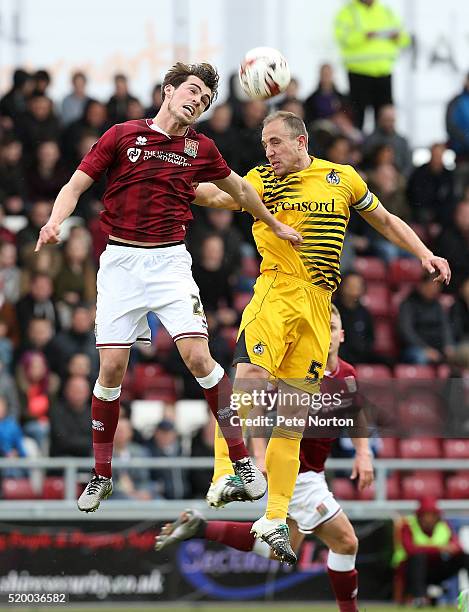 John Marquis of Northampton Town contests the ball with Mark McChrystal of Bristol Rovers during the Sky Bet League Two match between Northampton...