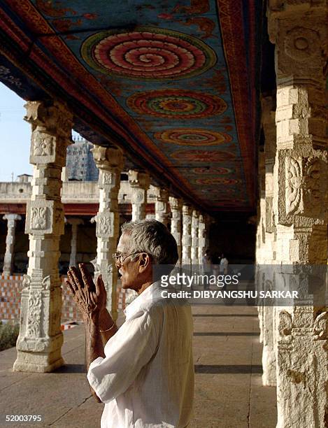 An Indian Hindu devotee prays at the Meenakshi Temple in Madurai, some 475kms southwest of Madras, 17 January 2005. The thirteenth century Hindu...