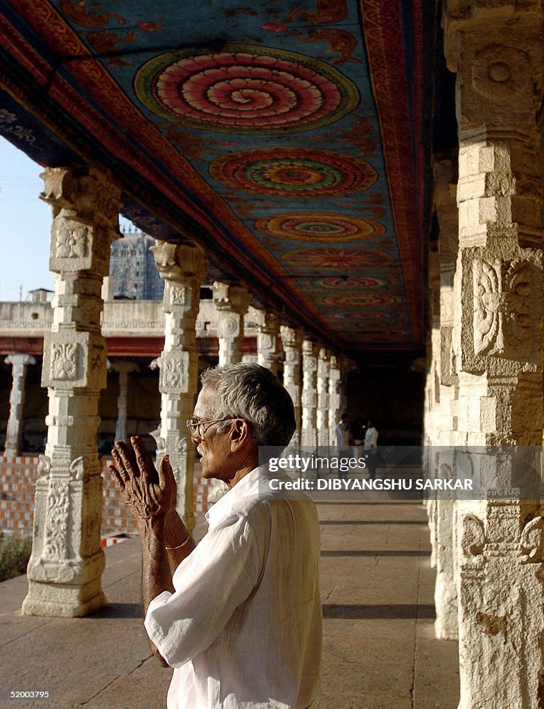An Indian Hindu devotee prays at the Mee