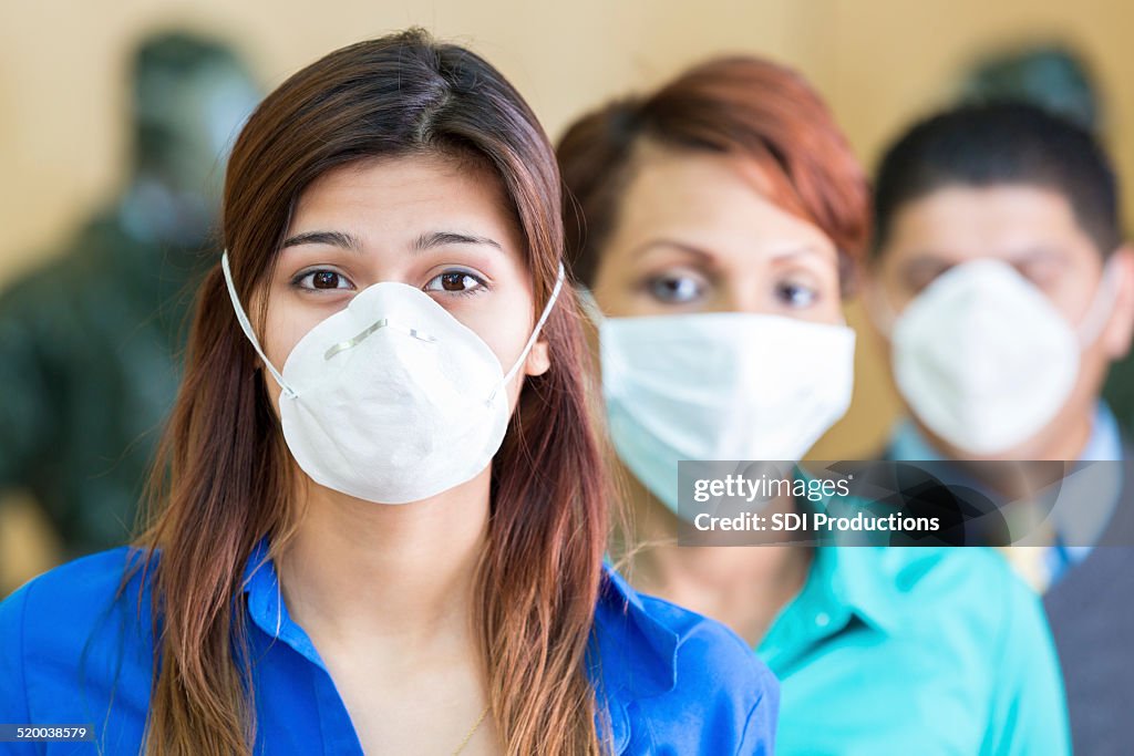 Business people wearing medical masks during flu or contagious pandemic