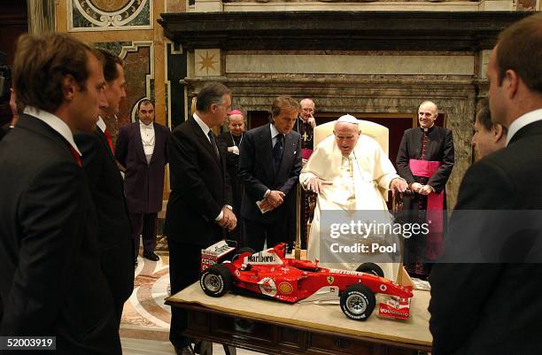 Pope John Paul II receives as a gift from Ferrari President Luca Cordero di Montezemolo, Michael Schumacher, Brazilian teammate Rubens Barrichello,...