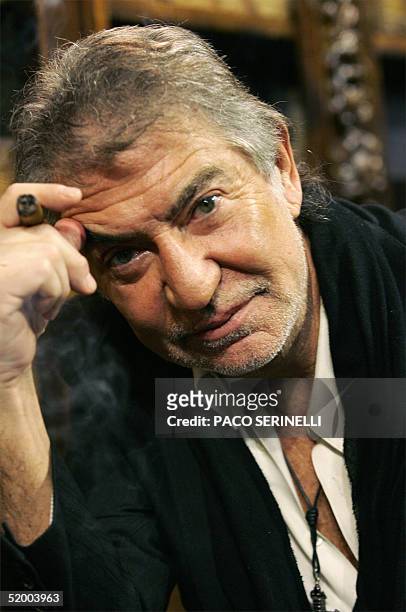 Italian designer Roberto Cavalli poses for the photographer before the presentation of his Fall/Winter 2005 collection, during Milan men's fashion...