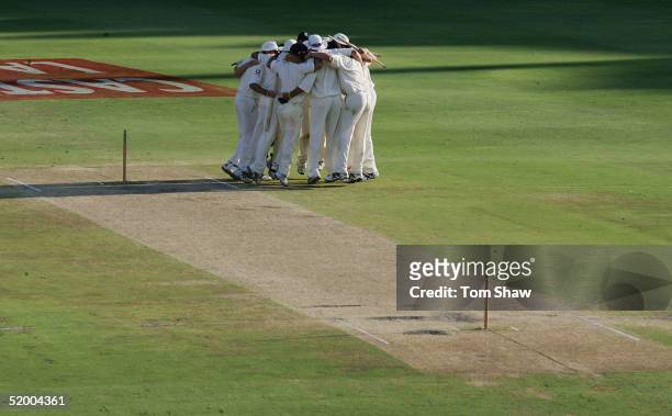 The England players celebrate in a huddle after beating South Africa on day five of the 4th Test between England and South Africa at the Wanderers...