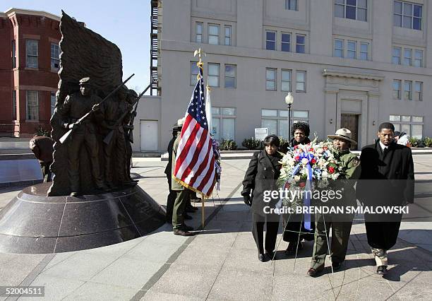 Park Rangers place a wreath at the African American Civil War Memorial after an interfaith "Prayer, Peace and Praise" service at the Tenth Street...