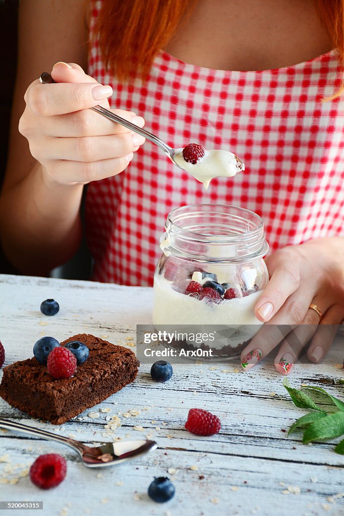 Redhead girl eating breakfast