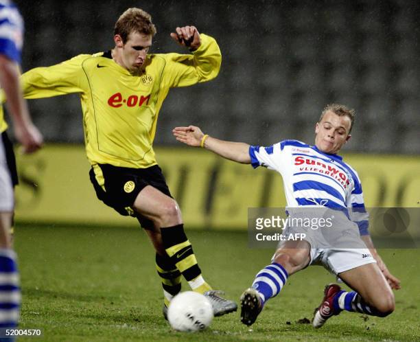 Ttja van Leerdam of de Graafschap duels for the ball with Borussia Dortmundplayer Florian Kringe during the benefit match De Graafschap vs Borussia...