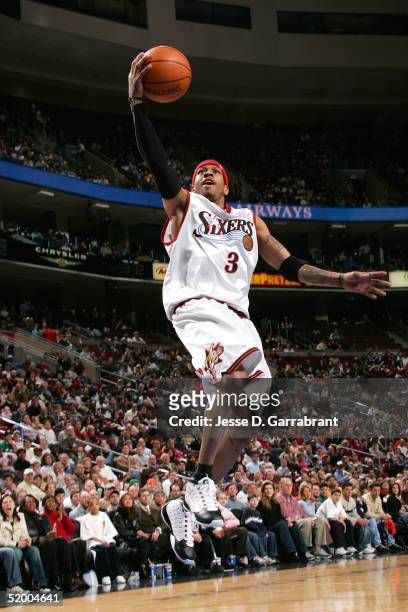 Allen Iverson of the Philadelphia 76ers lays one up past the defense of the New Orleans Hornets on January 17, 2005 at the Wachovia Center in...