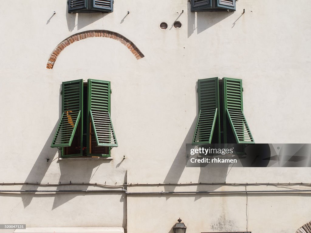 Building with green shutters, Lucca, Italy