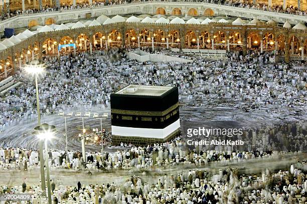 Muslim pilgrims pray at the holy Kaaba at Mecca's Grand Mosque during the annual hajj rituals January 17, 2005 in Mecca, Saudi Arabia. Officials say...