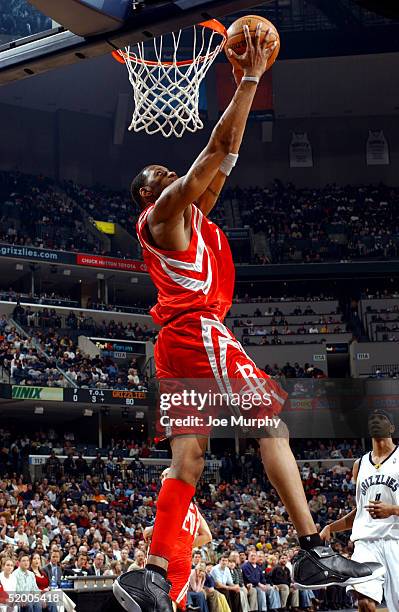 Tracy McGrady of the Houston Rockets dunks the ball during a game against the Memphis Grizzlies on January 17, 2005 at FedexForum in Memphis,...