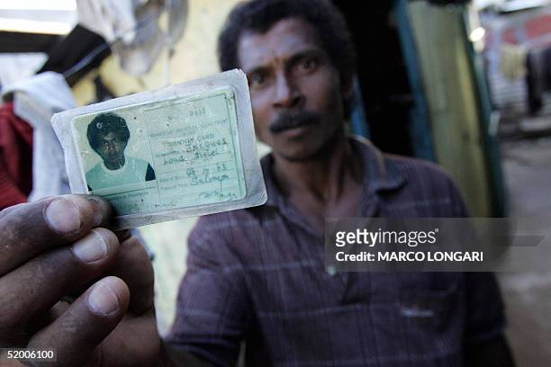 Jaques Louis Arniel shows, 17 January 2005 in Port Louis, Mauritius, his identity card stating his birth place as the Solomon Island, Chagos. Arniel,...