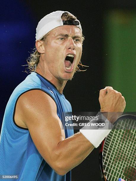 Third seeded Lleyton Hewitt of Australia celebrates winning the second set against Arnaud Clement of France in their men's singles first round match...