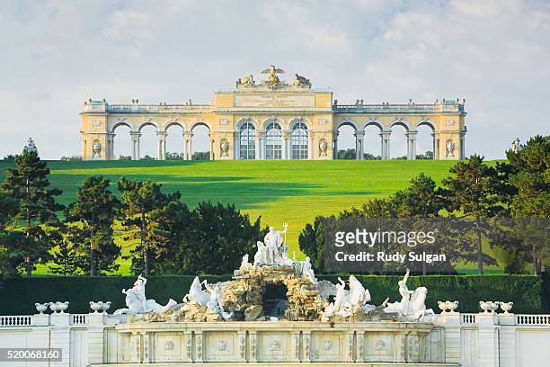 gloriette and neptune fountain at schloss schonbrunn - schonbrunn palace vienna stock pictures, royalty-free photos & images
