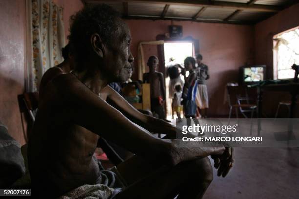 Louis Onesime sits in the house he shares with 26 other family members in Port Louis, Mauritius, 17 January 2005. Louis, originally from Diego Garcia...