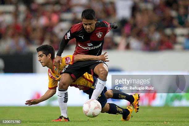 Juan Medina of Atlas fights for the ball with Jorge Zarate of Morelia during the 13th round match between Atlas and Morelia as part of the Clausura...