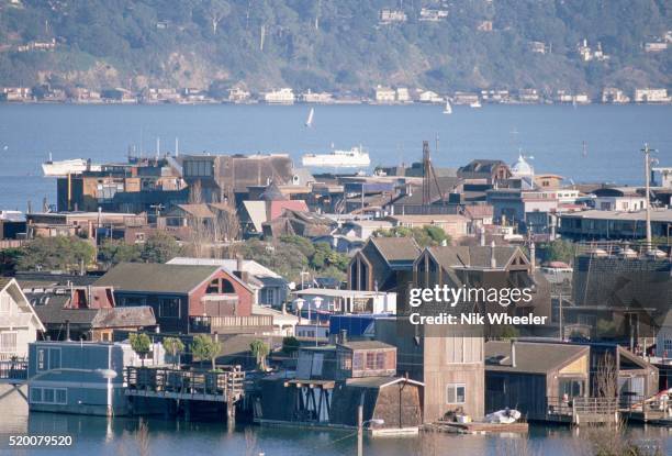 Houseboats are anchored around a spit of land at Sausalito, California.