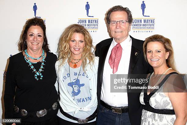 Anita Swift, Marisa Wayne, Patrick Wayne and Melanie Wayne attend the John Wayne Cancer Institute's 31st Annual Odyssey Ball at the Beverly Wilshire...