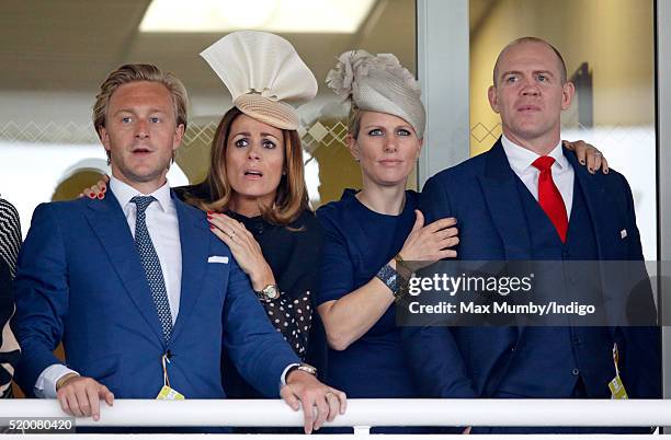 Owain Walbyoff, Natalie Pinkham, Zara Phillips and Mike Tindall watch the Grand National as they attend day 3 'Grand National Day' of the Crabbie's...