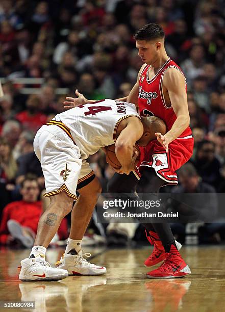 Richard Jefferson of the Cleveland Cavaliers tries to move against Doug McDermott of the Chicago Bulls at the United Center on April 9, 2016 in...