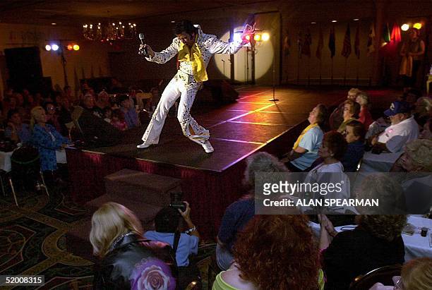 Dennis Stella of Calumet City, Illinois, performs during the "Images of the King Tribute" at the Holiday Inn Select Hotel 14 August 2002 in Memphis,...