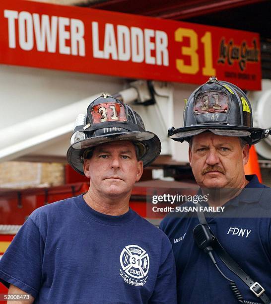 Ladder 31 Firemen John McGonigle and Kevin McGeary stand in front of their truck 28 August in the Bronx, NY. McGonigle and McGeary were subjects in...