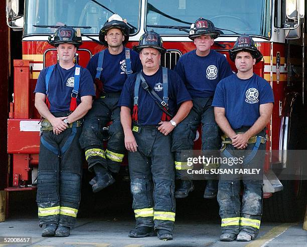 Ladder 31 firemen Charles J. McCormack , Richie Ramaizel , Kevin McGeary, , John McGonigle and Vincent Holfester stand in front of their truck 05...