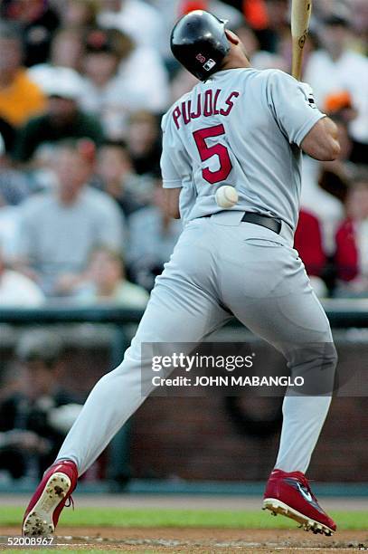 Albert Pujols of the St. Louis Cardinals is hit by a pitch from Livan Hernandez of the San Francisco Giants in the first inning 13 October 2002, in...