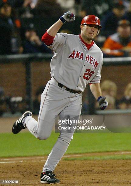 Anaheim Angels' Troy Glaus pumps his fist as he rounds the bases after hitting a two run homerun against the San Francisco Giants in the third inning...
