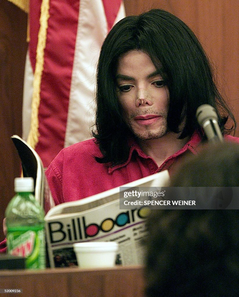 US entertainer Michael Jackson reads a Billboard m