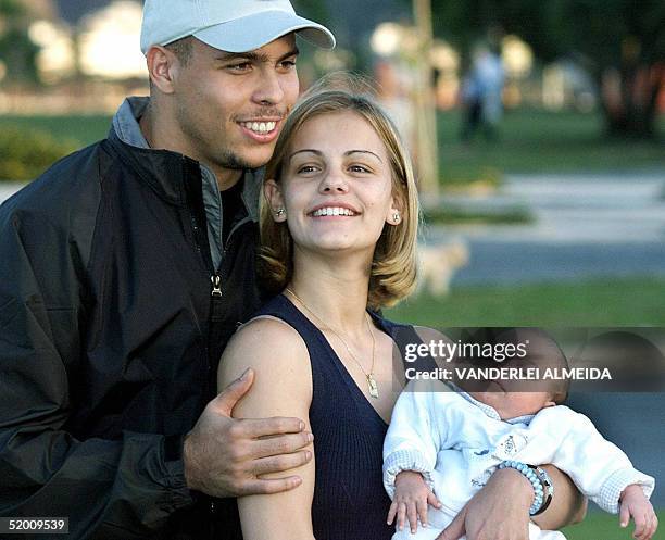 Brazilian soccer player Ronaldo Nazario is shown with his wife, Milene Domingues and son Ronald 29 May 2000 in Rio de Janeiro. The couple have...