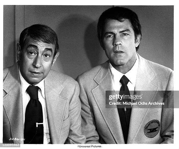 Sport commentators Howard Cosell and Frank Gifford look on during the movie "Two-Minute Warning" circa 1976 in Los Angeles, California.