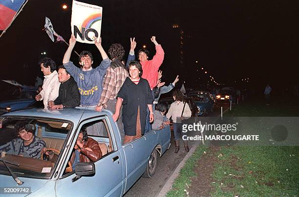 Hundreds of opposition supporters celebrate 06 October 1988 the defeat of General Augusto Pinochet in the 05 October 1988 in Santiago - "Yes or no" -...