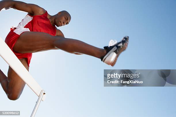 hurdler jumping - forward athlete bildbanksfoton och bilder