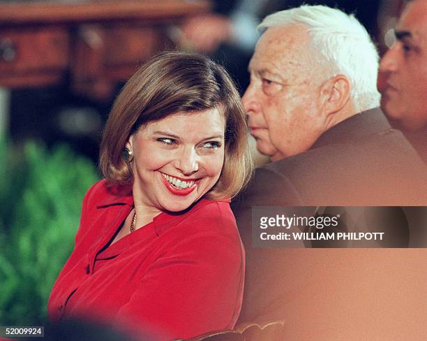 Sarah Netanyahu, wife of Israeli Prime Minister Benjamin Netanyahu, smiles during a signing ceremony for the Mideast peace agreement 23 October 1998...