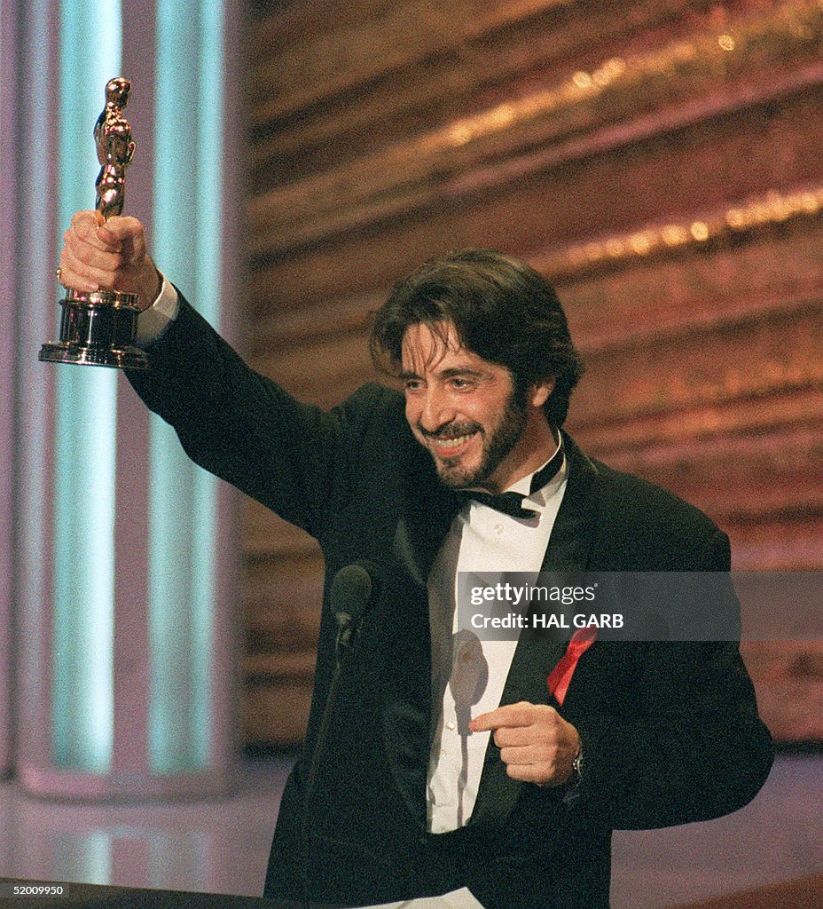 US actor Al Pacino holds up his Oscar during the 6