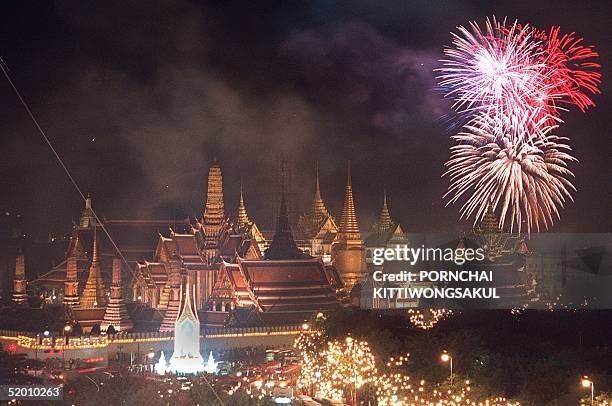 Fireworks illuminate Bangkok 05 Decemder in celebration of Thai King Bhumibol Adulyadej's birthday. Thailand came to a standstill today as the nation...