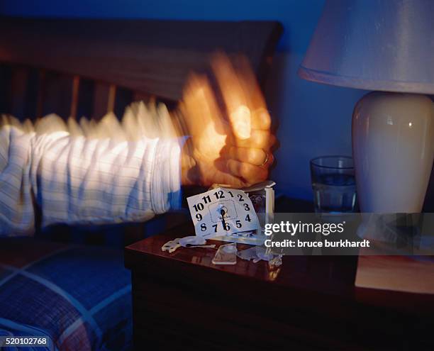 person hitting an alarm clock - hitting alarm clock stock pictures, royalty-free photos & images