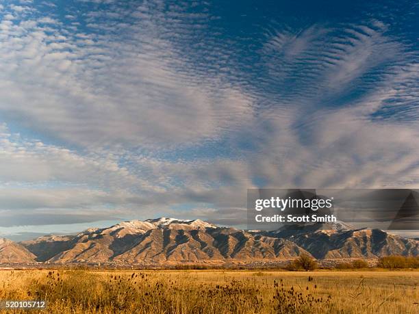 utah. usa. altoculumulus & orographic altostratus clouds above cache valley & bear river range in late autumn. - great basin stock pictures, royalty-free photos & images