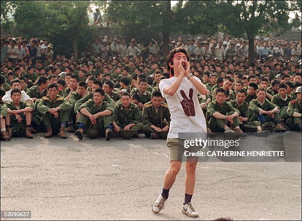 Dissident student asks soldiers to go back home as crowds flooded into the central Beijing 03 June 1989. On the night of 03 and 04 June 1989,...