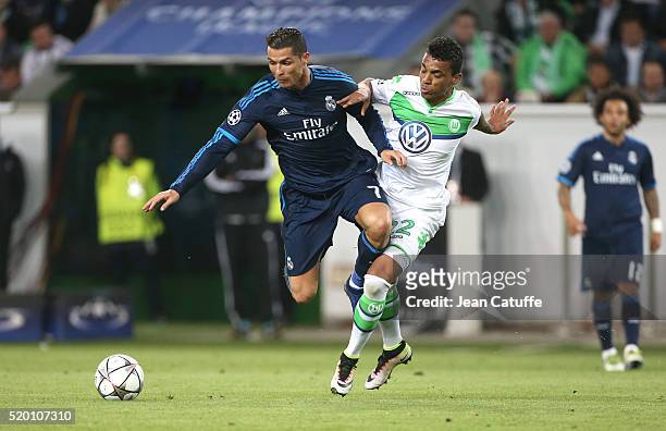 Cristiano Ronaldo of Real Madrid and Luiz Gustavo of Wolfsburg in action during the UEFA Champions League quarter final first leg match between VfL...