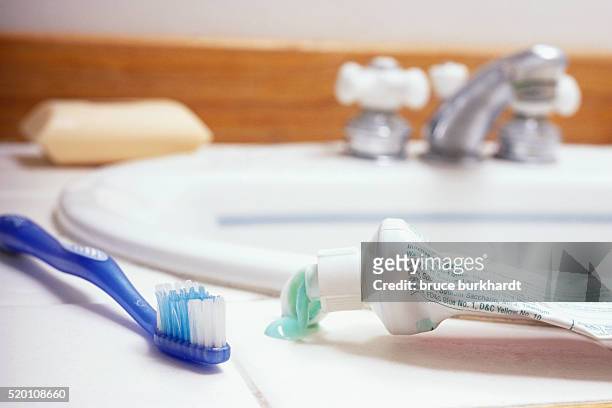 toothbrush on bathroom sink - bathroom no people stock pictures, royalty-free photos & images