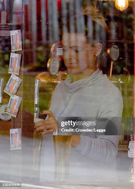 04th: Former British soap actress Shana Swash is seen working in a pub April 04, 2016 in London, England.