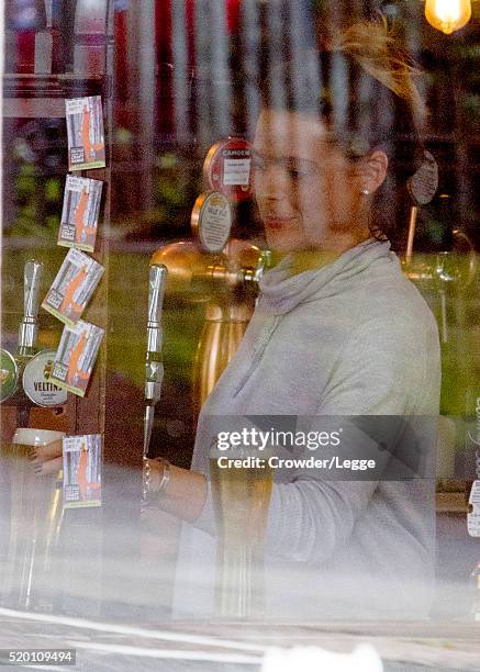 04th: Former British soap actress Shana Swash is seen working in a pub April 04, 2016 in London, England.