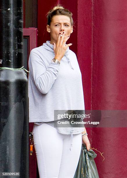 04th: Former British soap actress Shana Swash is seen working in a pub April 04, 2016 in London, England.