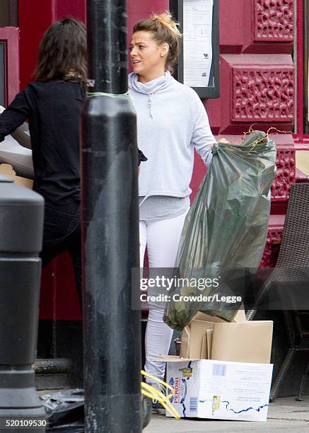 04th: Former British soap actress Shana Swash is seen working in a pub April 04, 2016 in London, England.