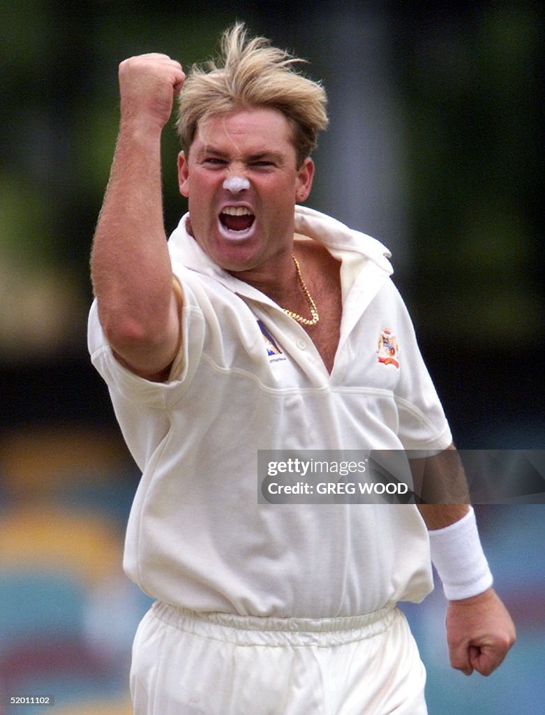 Australian leg-spinner Shane Warne celebrates afte